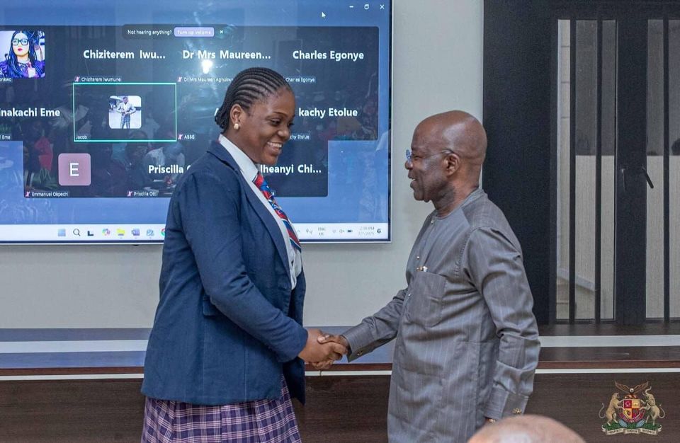 Officials and a student at a presentation event, July 2025